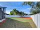 Backyard with playground, privacy fence, and landscaping at 7136 Colony Pointe Dr, Riverview, FL 33578