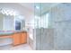 Elegant bathroom with a large glass shower and soaking tub at 7136 Colony Pointe Dr, Riverview, FL 33578