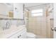 Clean bathroom with updated tile and a single vanity at 7930 Datura Lane Ln, New Port Richey, FL 34653