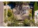 Aerial view of a house showing the backyard, hot tub, porch, driveway and lush landscaping at 8307 Boxwood Dr, Tampa, FL 33615