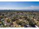 Expansive aerial view of a neighborhood near the water with blue skies and a distant city skyline at 8307 Boxwood Dr, Tampa, FL 33615