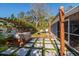 Backyard featuring a hot tub under a covered structure, screened-in porch, and decorative stones at 8307 Boxwood Dr, Tampa, FL 33615