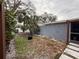 Backyard with gravel, string lights, and some landscaping at 8307 Boxwood Dr, Tampa, FL 33615