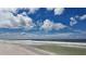 Expansive beach with ocean waves and blue sky at 8581 W Gulf Blvd, Treasure Island, FL 33706