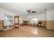 Large living room with hardwood floors and ceiling fan at 8581 W Gulf Blvd, Treasure Island, FL 33706