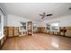 Large living room with hardwood floors and ceiling fan at 8581 W Gulf Blvd, Treasure Island, FL 33706