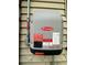 A Fronius Primo solar inverter installed on the exterior wall of a home at 8581 W Gulf Blvd, Treasure Island, FL 33706