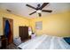 Bedroom with double bed, ceiling fan, dresser, and window blinds at 8742 Narcissus Ave, Seminole, FL 33777