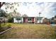 Charming brick home with landscaping and a spacious yard at 8742 Narcissus Ave, Seminole, FL 33777