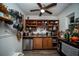 Charming kitchen featuring wood cabinets and a wall-mounted pot rack at 8742 Narcissus Ave, Seminole, FL 33777