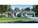 One-story house with teal garage door, light blue walls, and a neatly landscaped lawn at 9032 Evelyn Rd, Englewood, FL 34224