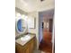 Bathroom with vanity, mirror, and view of hallway at 100 Waverly Way # 201, Clearwater, FL 33756