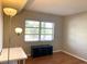 Bedroom with window, wood floors, and a simple workspace at 100 Waverly Way # 201, Clearwater, FL 33756
