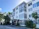 Two-story building exterior with stone accents and landscaping at 100 Waverly Way # 201, Clearwater, FL 33756