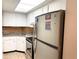 Small kitchen with white cabinets, and stainless steel appliances at 100 Waverly Way # 201, Clearwater, FL 33756