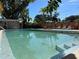 Refreshing community pool with lounge chairs and patio at 100 Waverly Way # 201, Clearwater, FL 33756