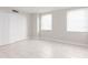 Well-lit bedroom featuring tile floors and ample closet space at 10355 Paradise Blvd # 212, Treasure Island, FL 33706