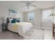 Spacious bedroom with ceiling fan and large windows at 10355 Paradise Blvd # 212, Treasure Island, FL 33706