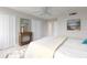 Spacious bedroom with a ceiling fan and neutral decor at 10355 Paradise Blvd # 212, Treasure Island, FL 33706