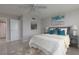 Bright bedroom with ceiling fan and rug at 10355 Paradise Blvd # 212, Treasure Island, FL 33706