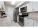 Modern kitchen with stainless steel appliances at 10355 Paradise Blvd # 212, Treasure Island, FL 33706