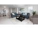 Open living and dining area with tiled floors at 10355 Paradise Blvd # 212, Treasure Island, FL 33706