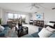 Living room with comfy seating and city views at 10355 Paradise Blvd # 212, Treasure Island, FL 33706