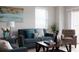 Living room features a comfy couch and tiled floors at 10355 Paradise Blvd # 212, Treasure Island, FL 33706