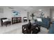 Bright living room with comfy seating and stylish decor at 10355 Paradise Blvd # 212, Treasure Island, FL 33706
