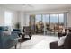 Bright living room with balcony access and city views at 10355 Paradise Blvd # 212, Treasure Island, FL 33706