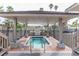Relaxing spa with covered seating and brick flooring at 10355 Paradise Blvd # 212, Treasure Island, FL 33706