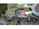 Property sits on a large lot with a pool and is surrounded by trees and nature at 10929 Brooksnest Ct, Lithia, FL 33547