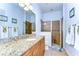 Clean bathroom with granite vanity and walk-in shower at 10929 Brooksnest Ct, Lithia, FL 33547