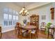 Elegant dining room with hardwood floors and a chandelier at 10929 Brooksnest Ct, Lithia, FL 33547
