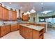 Open kitchen with granite countertops and a large island, perfect for entertaining at 10929 Brooksnest Ct, Lithia, FL 33547