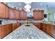 Large kitchen with granite countertops and an island, offering plenty of counter space at 10929 Brooksnest Ct, Lithia, FL 33547