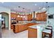 Modern kitchen with granite countertops, ample cabinetry, and an island at 10929 Brooksnest Ct, Lithia, FL 33547