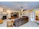 Comfortable living room with a stone fireplace and leather sofa at 10929 Brooksnest Ct, Lithia, FL 33547