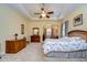 Spacious main bedroom with a king-size bed and a sitting area at 10929 Brooksnest Ct, Lithia, FL 33547