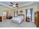 Spacious main bedroom with sitting area and large windows at 10929 Brooksnest Ct, Lithia, FL 33547