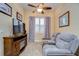 Relaxing media room with comfortable seating and fireplace at 10929 Brooksnest Ct, Lithia, FL 33547