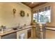Granite countertop outdoor kitchen with grill and sink at 10929 Brooksnest Ct, Lithia, FL 33547