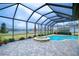 Relaxing screened pool and spa; view of lake at 10929 Brooksnest Ct, Lithia, FL 33547