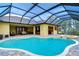 Inviting pool area with screened enclosure, spa, and patio at 10929 Brooksnest Ct, Lithia, FL 33547
