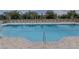 Community pool with plenty of seating and a pool lift at 12358 Hilltop Farms Dr, Dade City, FL 33525