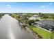 Elevated view of waterfront home with pool and dock at 13477 Irwin Dr, Port Charlotte, FL 33953