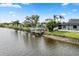 Waterfront property showcasing a house and dock from above at 13477 Irwin Dr, Port Charlotte, FL 33953