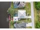 Aerial view showing house, pool, dock, and waterway at 13477 Irwin Dr, Port Charlotte, FL 33953