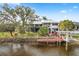 Two-story waterfront home with a dock and pool at 13477 Irwin Dr, Port Charlotte, FL 33953