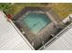 Aerial view of a private screened pool and patio area at 13477 Irwin Dr, Port Charlotte, FL 33953